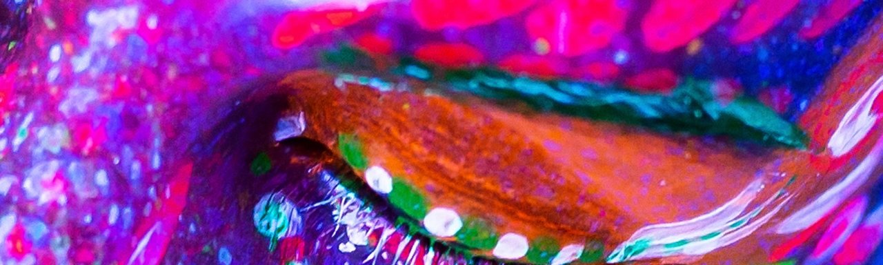 Portrait of a girl painted in fluorescent powder Portrait of a girl painted in fluorescent powder